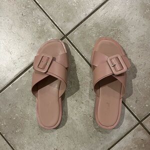 Cute light pink sandals with a buckle in a size 7!